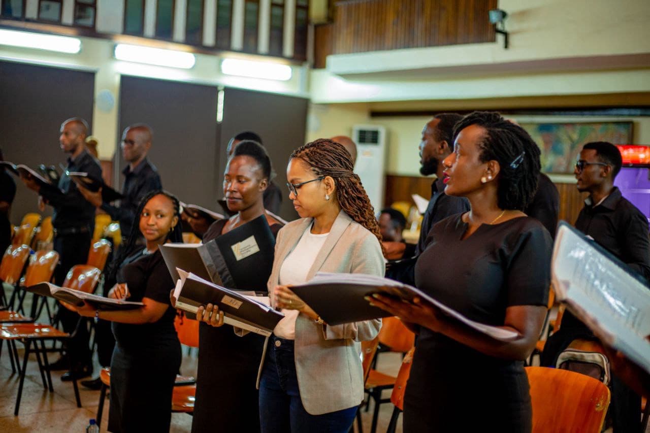 Choir rehearsing with folders in the concert hall