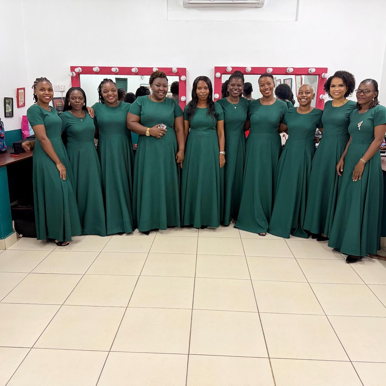 Women of the Christmas by Candlelight ensemble in emerald gowns