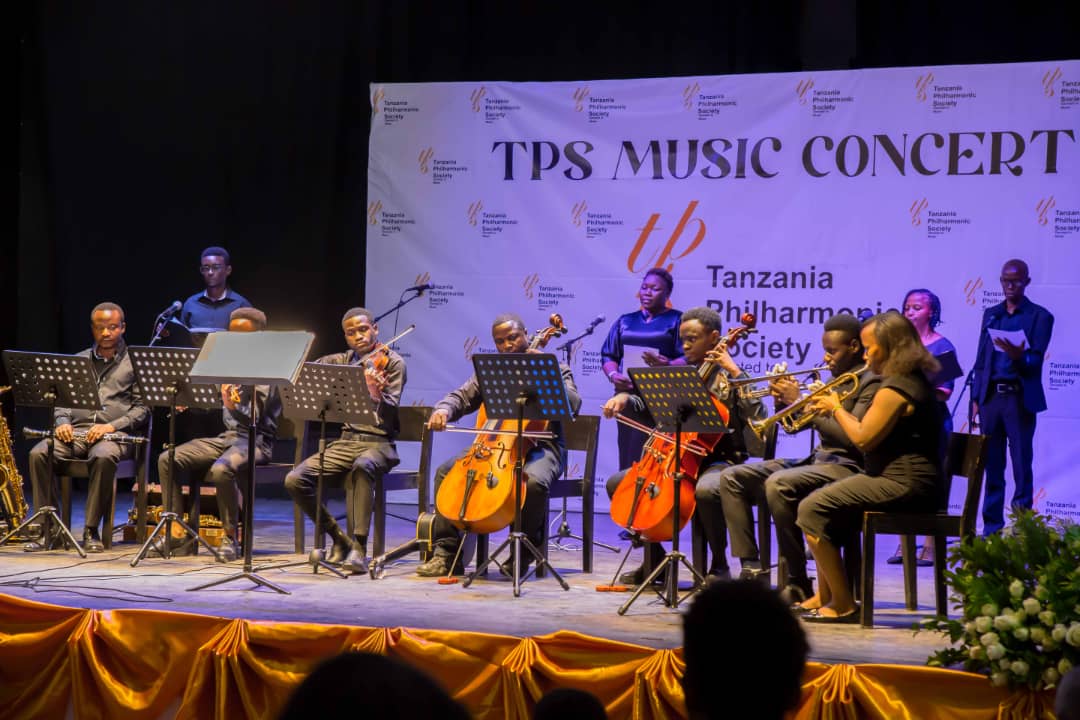 Sacred Harmonies choir lined on the TPS Music Concert stage