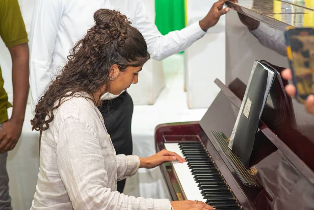 Pianist at the keys before and during a TPS gathering