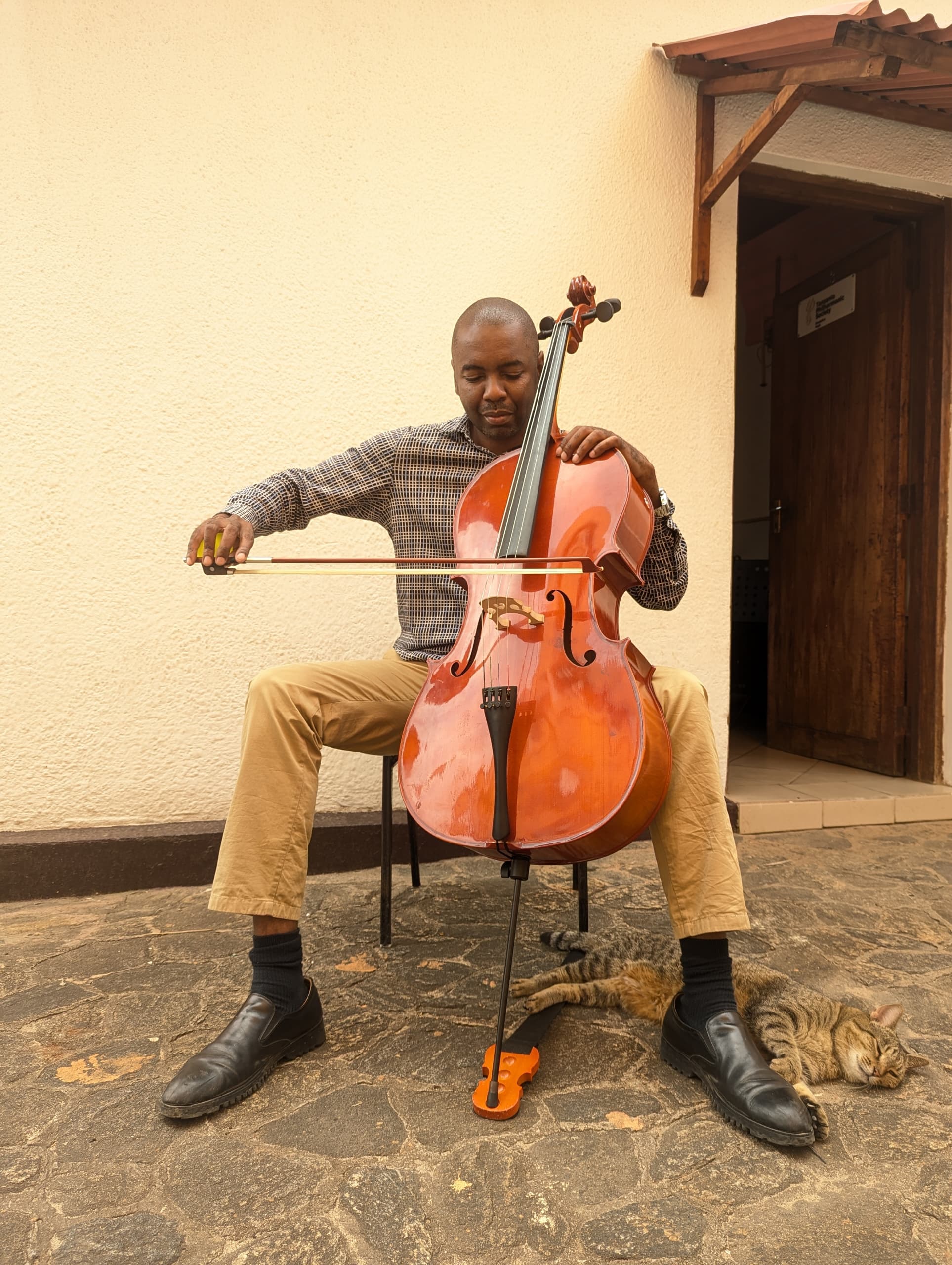 Cellist practising outdoors during TPS string classes