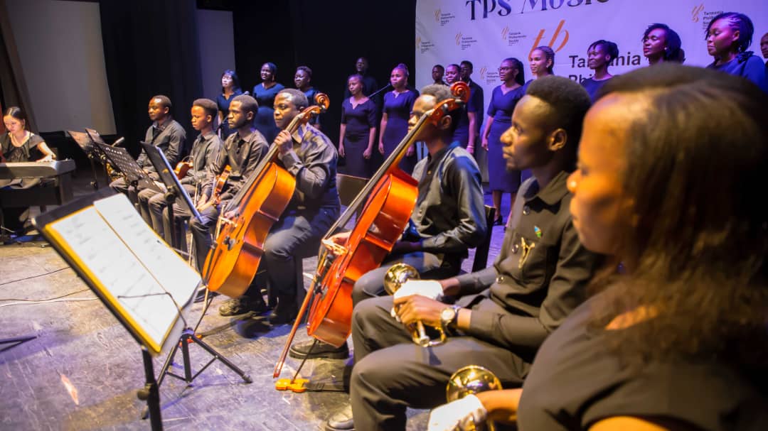 Tanzania Philharmonic Society orchestra and choir performing on stage